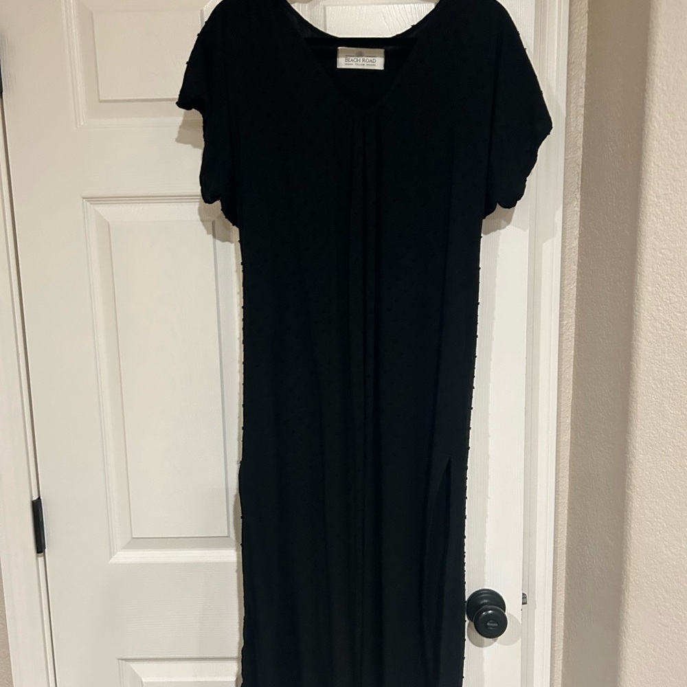 Black mid length dress or beach cover up.